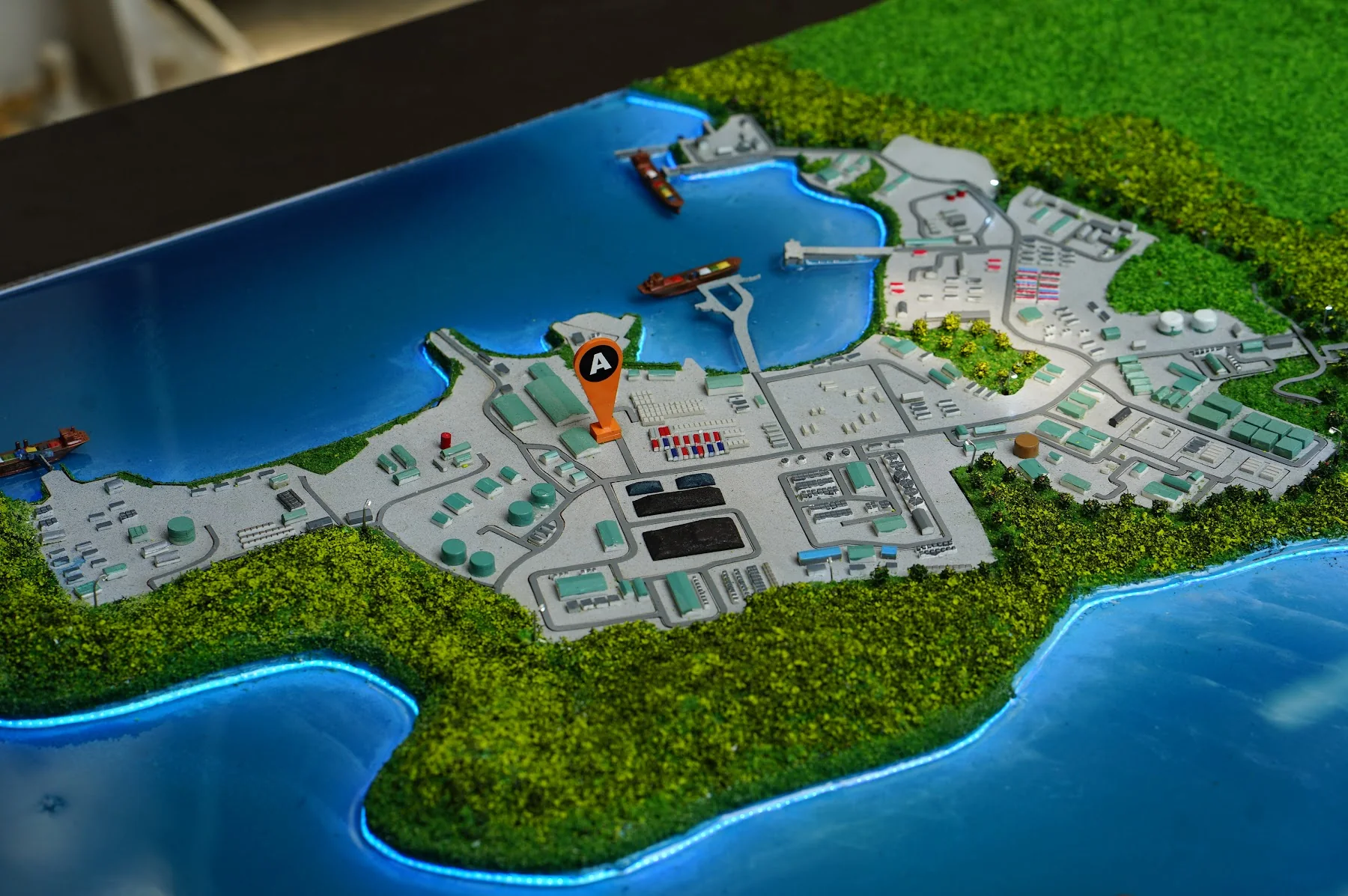 Amman Mineral industrial masterplan diorama with coastal context.