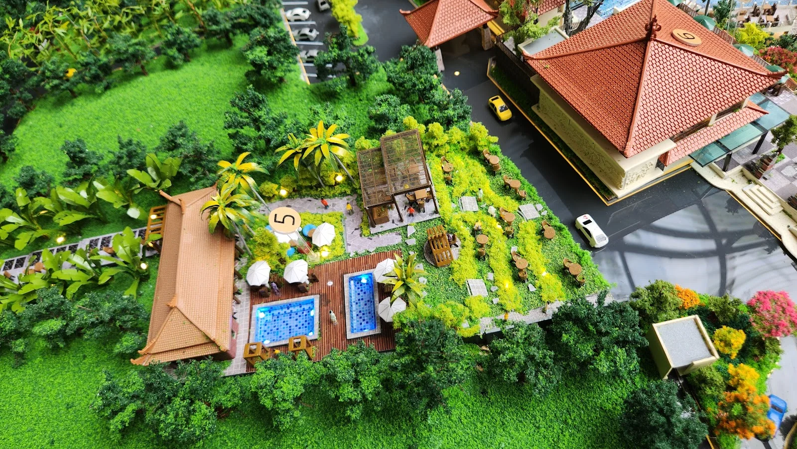 Resort-style landscape and pool detail in miniature.