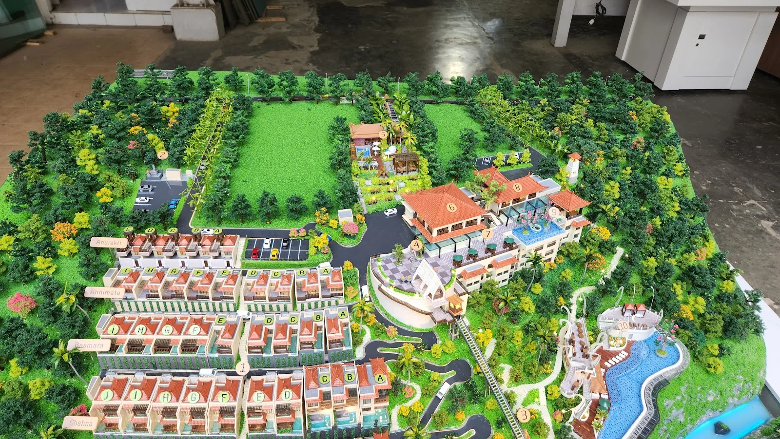 Residential and resort masterplan diorama with landscape and buildings.